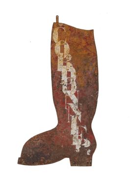 a rusted boot shaped object on a white background