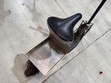 a scooter that has a seat on the back of it