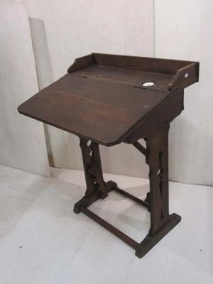 a small wooden desk with a drawer on it