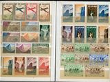 an open book with stamps and a picture of people on the pages