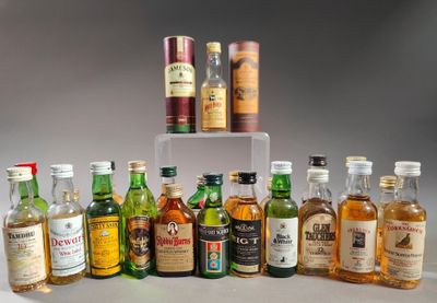 many different types of alcohol bottles on a table