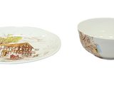 a cup and saucer sitting next to each other on a plate