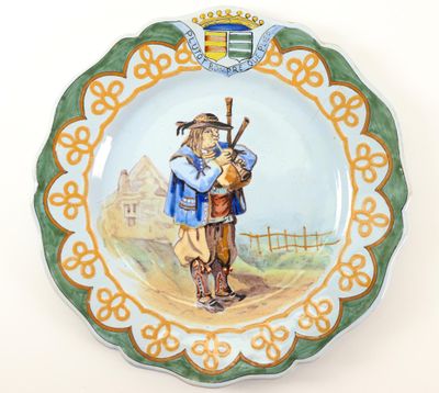 a plate with a picture of a man and a dog on it