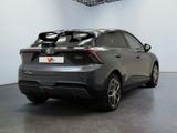 a car that is parked in a room with a ceiling fan