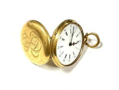 a gold pocket watch with a clock inside of it
