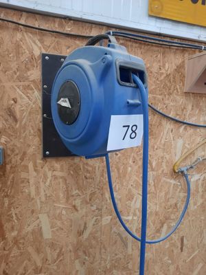 a blue air blower attached to a wall