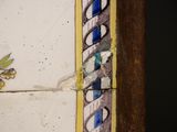 a close up of a tile with a flower design on it
