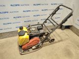 an image of a lawn mower with a gas can on it