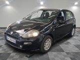 a picture of a small black car on a checkered floor