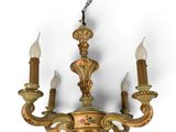 an image of a chandelier with three candles hanging from it ' s ceiling
