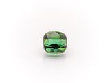 a green tourmaline stone on a white background