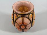 a picture of a vase that is sitting on a table