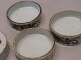 three small bowls are sitting next to each other on a table