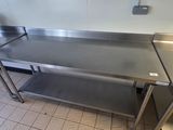 a stainless steel table in a commercial kitchen