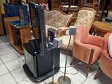 a television that is sitting on a stand in the middle of a room