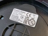 a close up of a button on the side of a trash can