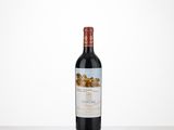 a bottle of red wine sitting on top of a table