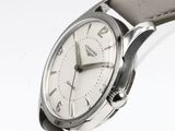 a watch that is sitting on a white surface