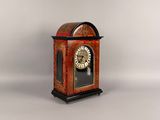 a small clock that is sitting on a table