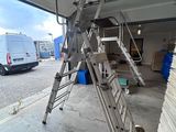 a ladder that is leaning up against a building