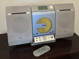 a radio that is sitting on a table next to a remote