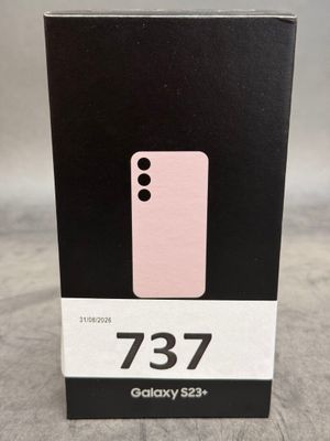 une boîte sur laquelle est posé un téléphone rose, posée sur une table