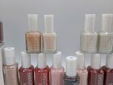 the bottles of nail polish are lined up on the table