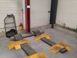 a garage with several pieces of equipment in it