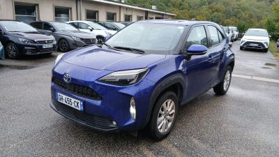 a blue toyota rav parked in a parking lot