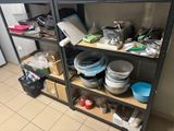 a lot of dishes and bowls on the shelves in the kitchen