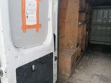 a white van with a door open on the side of the road