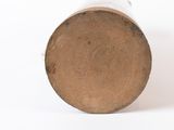 a close up view of a wooden object on a white surface