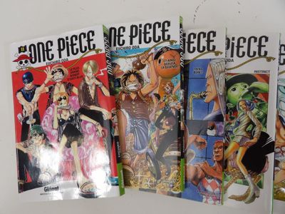 a lot of comic books on the table together