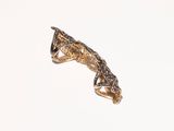 a gold ring with a lizard on top of it