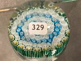 a glass ornament that has a number on it