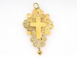 a close up of a gold cross on a white background