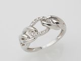 a white gold ring with diamonds set in the middle