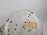 a white plate with a clock on it on a table