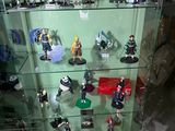 many figurines on display in a glass case