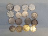 several different types of coins sitting on top of a table