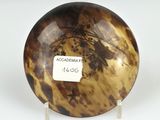 an image of a brown and black plate with a label on it