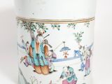 a white container with a painting of people on it