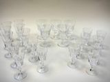 a lot of wine glasses that are sitting on a table