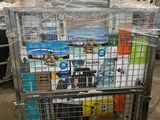 a metal cart with many items in it in a warehouse