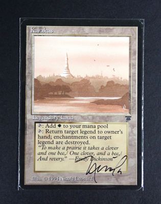 a close up of a card with a picture of a city in the background