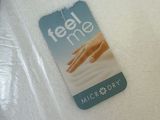 a white towel that has a tag on it