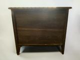 an old wooden dresser with a drawer on top of it