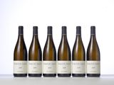 six bottles of wine lined up in a row on a table