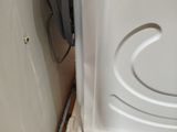 an image of a bathroom with a toilet and a door