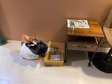 a small table with a magazine on it next to a chair